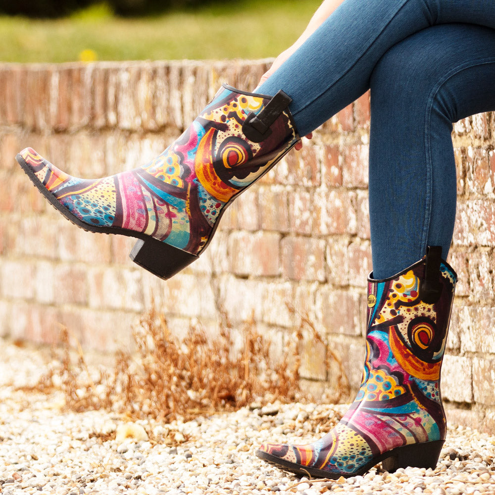 Bold colourful floral print women's welly boots. Your perfect waterproof festival companion