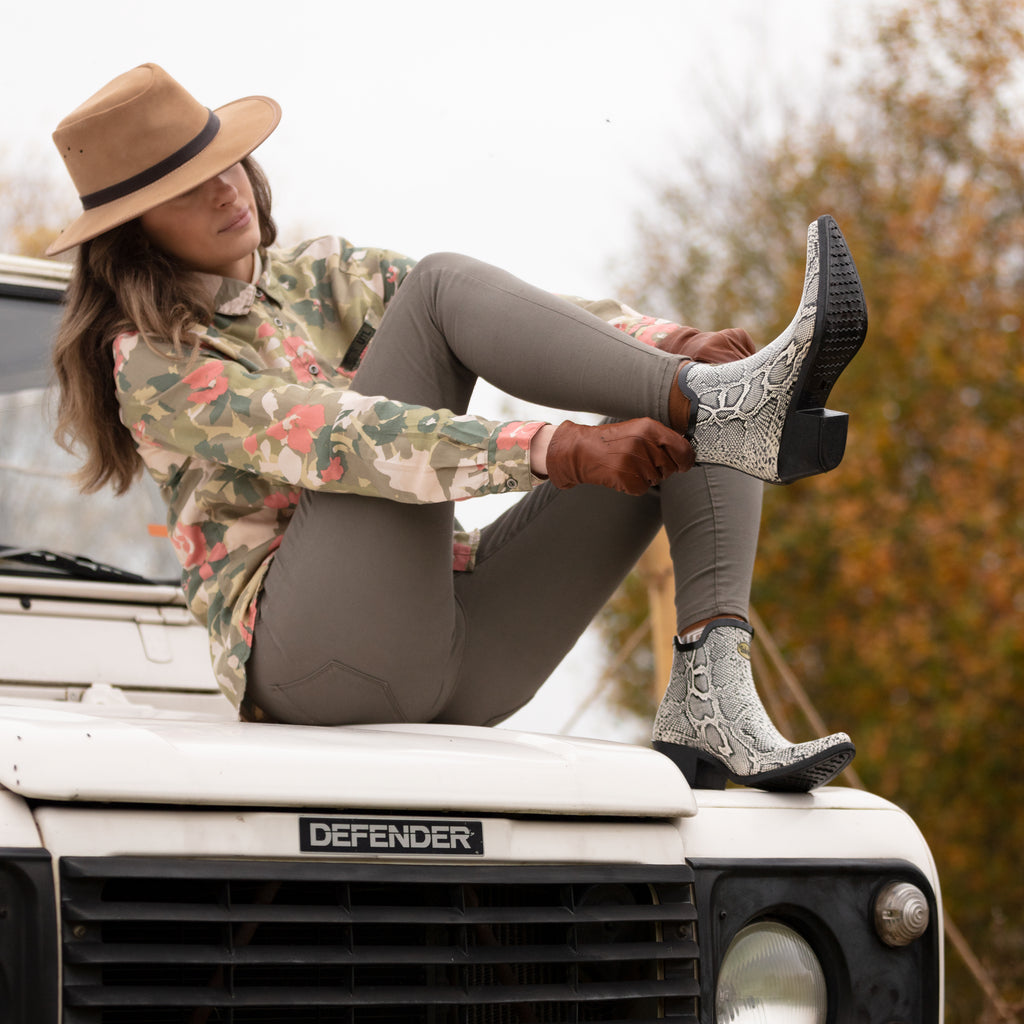 Chic and stylish, these Talolo Women's Lizzie snake print black and white pointed cowboy welly ankle boots have a 3cm heel. Lined for comfort.