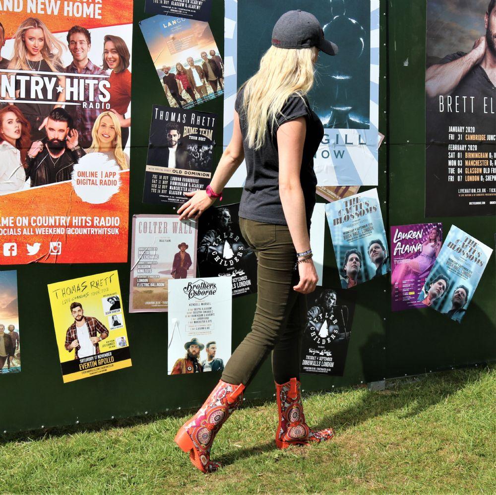 Zesty and full of life, these Talolo Women's orange aztec patterned, funky cowboy welly boots are heeled to give you sophistication and will reach the middle of the calf. Lined for comfort.