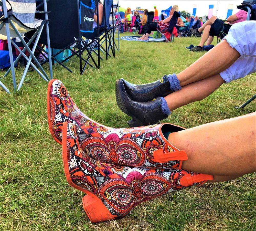 Zesty and full of life, these Talolo Women's orange aztec patterned, funky cowboy welly boots are heeled to give you sophistication and will reach the middle of the calf. Lined for comfort.