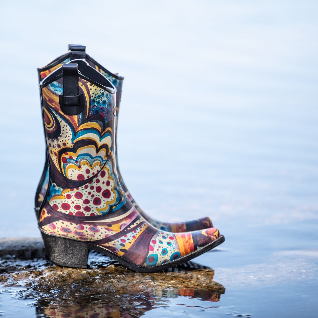 Wild, bright and super funky with prints of pink, blue and yellow, these Talolo Women's Floral Bliss pointed cowboy welly boots have a 3cm heel and will reach the middle of your calf. Lined for comfort.