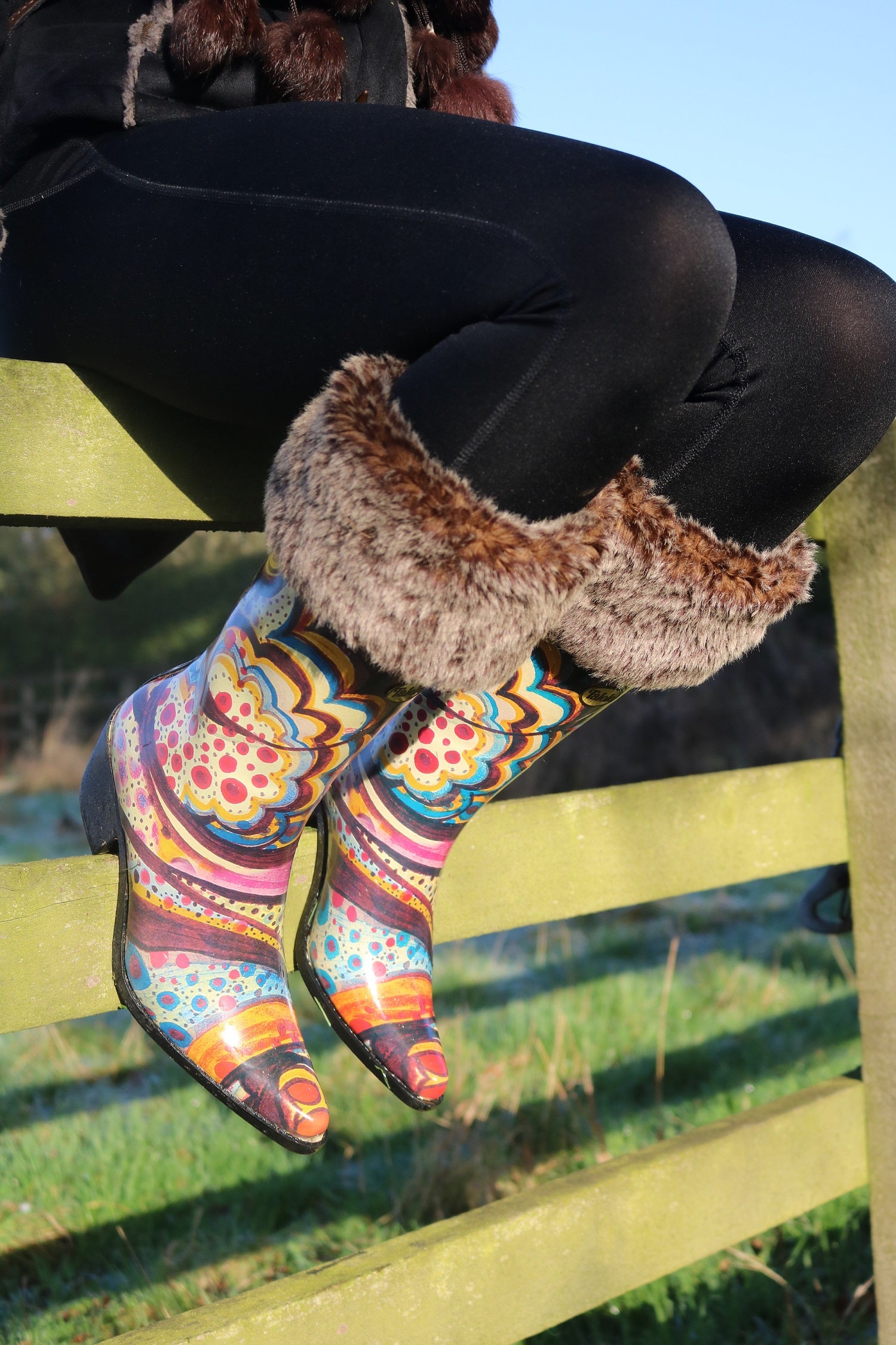 Wild, bright and super funky with prints of pink, blue and yellow, these Talolo Women's Floral Bliss pointed cowboy welly boots have a 3cm heel and will reach the middle of your calf. Lined for comfort.