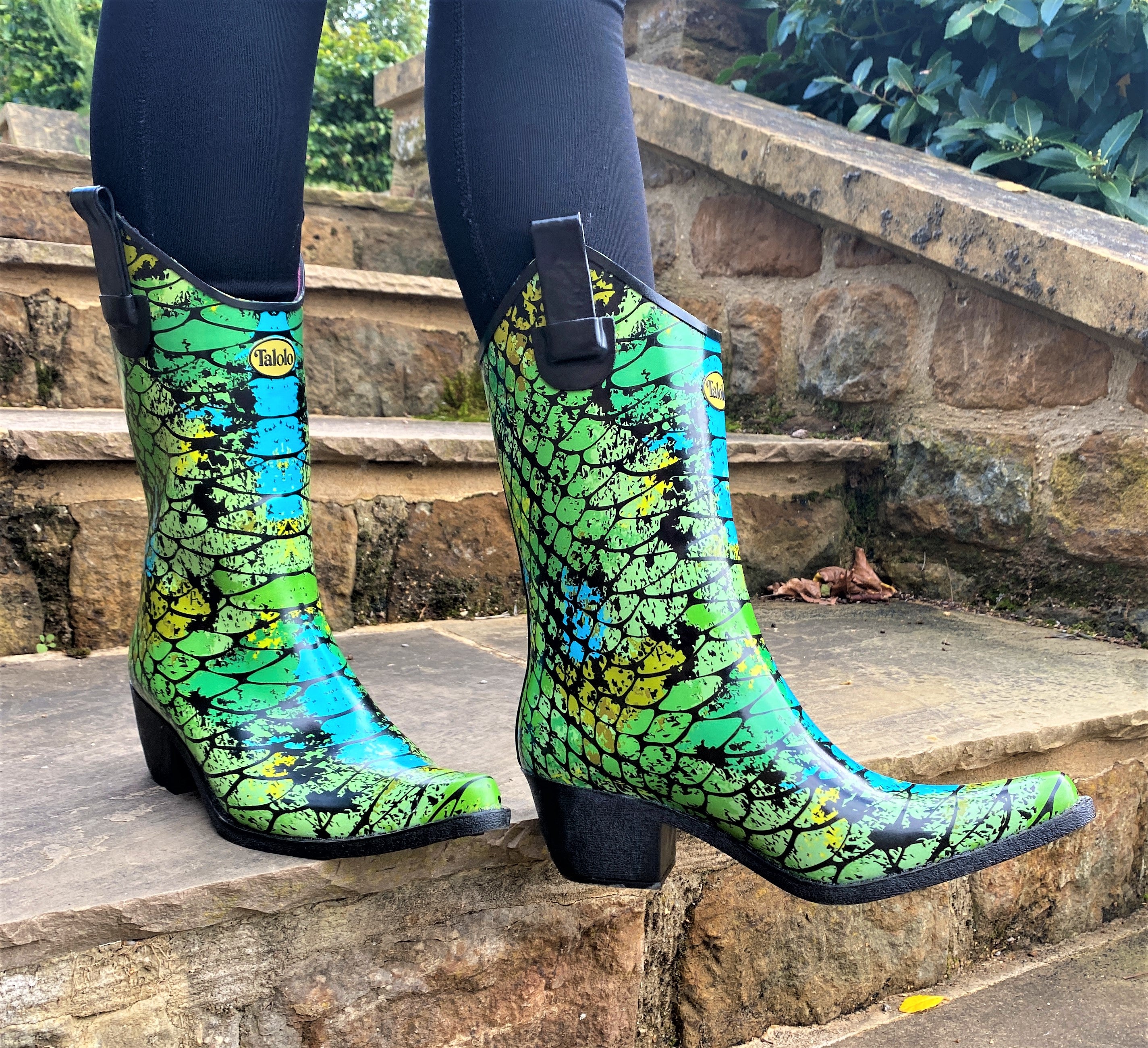 Make heads turn in in these utterly fabulous and exotic Talolo Women's Peacock green and blue pointed cowboy welly boots that have a 3cm heel and cut close to the leg for a flattering look. Lined for comfort.